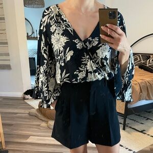 Floral black and ivory top with bell sleeves